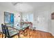Dining room with hardwood floors, leading to white front door at 3062 Eastland Blvd # 311, Clearwater, FL 33761