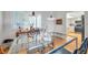 Dining room looking toward the kitchen with hardwood flooring and natural light at 3062 Eastland Blvd # 311, Clearwater, FL 33761