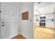 Entryway with hardwood floors and a view into the kitchen at 3062 Eastland Blvd # 311, Clearwater, FL 33761