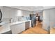 White kitchen with stainless steel appliances and plenty of counter space at 3062 Eastland Blvd # 311, Clearwater, FL 33761