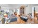 Bright living room features hardwood floors, natural light, and ample space at 3062 Eastland Blvd # 311, Clearwater, FL 33761