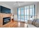 Bright living room features hardwood floors, a fireplace, and a sliding door leading to the patio at 3062 Eastland Blvd # 311, Clearwater, FL 33761