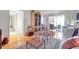 Comfortable living room featuring hardwood floors, elegant furnishings and an inviting view to the outside patio at 3062 Eastland Blvd # 311, Clearwater, FL 33761