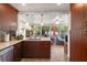 Inviting kitchen with stainless steel appliances, modern cabinets, and open access to a sunny sitting area at 4321 S Thatcher Ave, Tampa, FL 33611