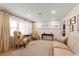 Bright living room features wood floors, neutral walls, a sofa, and stylish decor at 4321 S Thatcher Ave, Tampa, FL 33611