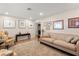 Bright living room features wood floors, neutral walls, a sofa, and stylish decor at 4321 S Thatcher Ave, Tampa, FL 33611