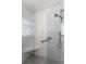 Updated glass shower with white marble tile and modern fixtures at 4321 S Thatcher Ave, Tampa, FL 33611