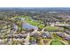 Stunning aerial view of a golf course community with multiple lakes and lush green spaces at 4515 Bent Tree Blvd, Sarasota, FL 34241