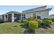 Landscaped backyard with lush greenery and screened lanai at 4515 Bent Tree Blvd, Sarasota, FL 34241