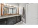 This large bathroom features double sinks and a view of the bathtub/shower at 4515 Bent Tree Blvd, Sarasota, FL 34241