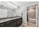 Double sink bathroom featuring granite countertops and vanity with an interior view of the shower/bath at 4515 Bent Tree Blvd, Sarasota, FL 34241