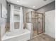 This bathroom boasts a shower and bathtub with tiled floors, and a window at 4515 Bent Tree Blvd, Sarasota, FL 34241