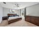 This well-lit bedroom has a neutral color palette and carpeted floors at 4515 Bent Tree Blvd, Sarasota, FL 34241