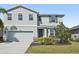 Charming two-story home with a well-maintained lawn and a two car garage at 4515 Bent Tree Blvd, Sarasota, FL 34241