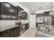 Well-appointed kitchen with dark cabinetry, stainless steel appliances, and a tile backsplash at 4515 Bent Tree Blvd, Sarasota, FL 34241