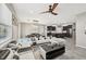 Spacious living room with a ceiling fan, open to the kitchen and dining areas at 4515 Bent Tree Blvd, Sarasota, FL 34241