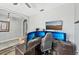 Home office equipped with multiple monitors, an ergonomic chair, and neutral decor at 4515 Bent Tree Blvd, Sarasota, FL 34241