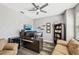 Functional home office setup with a large desk, multiple monitors, and comfortable seating at 4515 Bent Tree Blvd, Sarasota, FL 34241