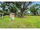 Spacious backyard featuring mature trees and lush grass, providing a peaceful outdoor setting at 4708 Bugg Rd, Plant City, FL 33567
