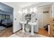 Dual sinks create a spacious bathroom with bedroom access, linen closet, and modern lighting at 4708 Bugg Rd, Plant City, FL 33567