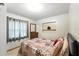 Comfortable bedroom featuring neutral colors and curtains to let the natural light in at 4708 Bugg Rd, Plant City, FL 33567
