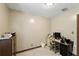 Bedroom with small computer desk, wooden chair, and beige walls at 4708 Bugg Rd, Plant City, FL 33567