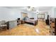 Cozy bedroom featuring hardwood floors and a ceiling fan at 4708 Bugg Rd, Plant City, FL 33567