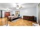 Bright bedroom featuring hardwood floors and a decorative bedspread at 4708 Bugg Rd, Plant City, FL 33567
