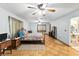 Spacious bedroom with hardwood floors, ceiling fans and natural light at 4708 Bugg Rd, Plant City, FL 33567
