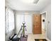 Small exercise room featuring large storage closet and doorway with Florida State University decor at 4708 Bugg Rd, Plant City, FL 33567