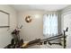Home gym including Xtreme machine, decorative clock, and gray walls with window at 4708 Bugg Rd, Plant City, FL 33567