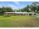 Charming single-story home with a well-manicured lawn and cozy covered parking at 4708 Bugg Rd, Plant City, FL 33567