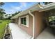 Exterior view of the side of the home with a covered parking area at 4708 Bugg Rd, Plant City, FL 33567