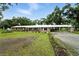 Well-maintained single-story home with a spacious yard and covered parking area at 4708 Bugg Rd, Plant City, FL 33567