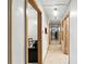 Long hallway leading past a bedroom featuring decorative beige and white flooring at 4708 Bugg Rd, Plant City, FL 33567