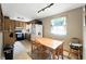 Kitchen/Dining area features wood cabinets, a table, and appliances at 4708 Bugg Rd, Plant City, FL 33567