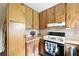 Kitchen featuring wood cabinets and modern appliances at 4708 Bugg Rd, Plant City, FL 33567