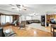 Cozy living room with a sectional sofa, hardwood floors, and an open layout at 4708 Bugg Rd, Plant City, FL 33567