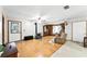 Spacious living room with wood flooring and a wood burning stove at 4708 Bugg Rd, Plant City, FL 33567