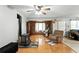 Inviting living room featuring a wood-burning stove and wood flooring at 4708 Bugg Rd, Plant City, FL 33567