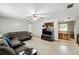 Bright living room featuring speckled floors and an open floor plan at 4708 Bugg Rd, Plant City, FL 33567