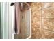 Shower features unique brown tile surround and shower curtain at 4708 Bugg Rd, Plant City, FL 33567