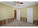 Bedroom with doorway and closet, ready for renovation with yellow walls at 4717 W Anita Blvd, Tampa, FL 33611