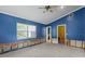 Primary bedroom featuring natural light and access to the bathroom and hallway at 4717 W Anita Blvd, Tampa, FL 33611