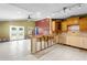 A spacious kitchen and living room area that has an open floor plan and double doors leading to the backyard at 4717 W Anita Blvd, Tampa, FL 33611