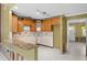 Charming kitchen featuring wooden cabinetry and a granite countertop bar area at 4717 W Anita Blvd, Tampa, FL 33611