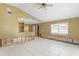 Spacious living room featuring tile flooring and large window allowing plenty of natural light at 4717 W Anita Blvd, Tampa, FL 33611
