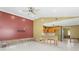 A spacious living room and kitchen area that has open access and natural lighting at 4717 W Anita Blvd, Tampa, FL 33611