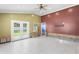Spacious room with white tile floors, french doors and visible wall framing at 4717 W Anita Blvd, Tampa, FL 33611