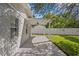 Covered patio with concrete flooring, ceiling fan, and view of the backyard with a white fence at 4717 W Anita Blvd, Tampa, FL 33611